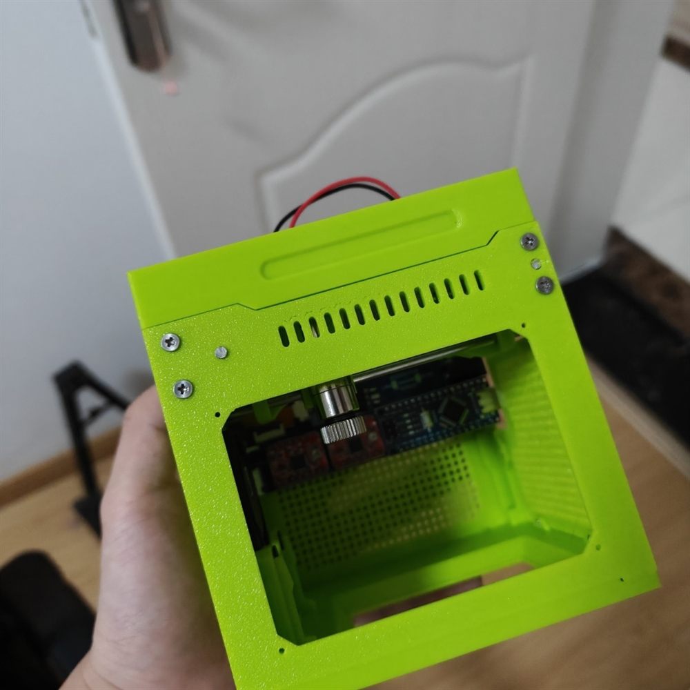 Green mini laser engraver with compact enclosed 3D printed shell