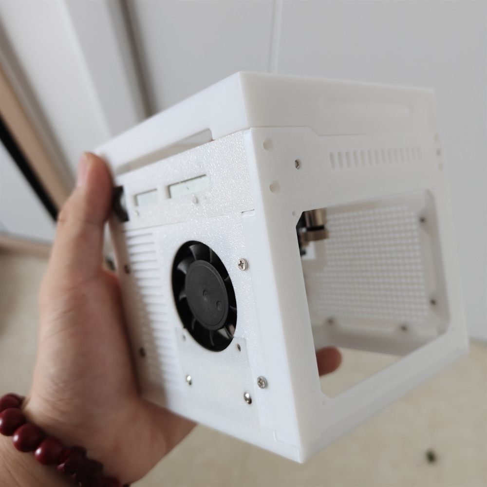 White mini laser engraver side view with cooling fan