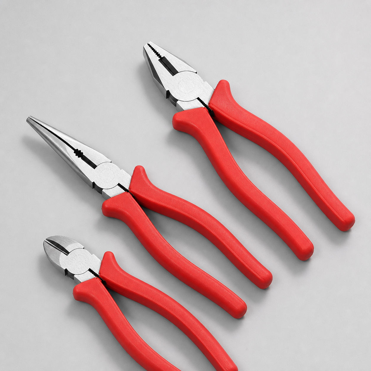 Unbranded three-piece CR-V workshop pliers collection on a studio background